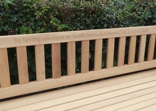 Close up of the engraved top rail of the York bench