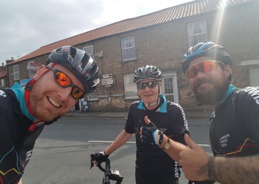 Thumbs up! Mike Davidson and team mates pose for a quick photo