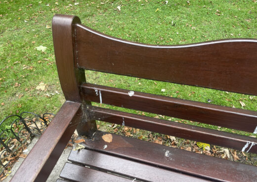 Detail view of a 16 year old Beverley Bench with dark varnish