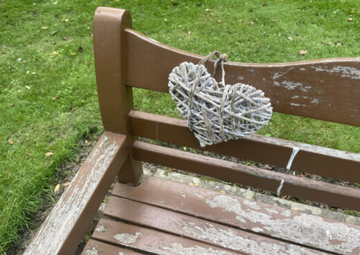 Detail view of a 30 year old Beverley Bench with tan varnish