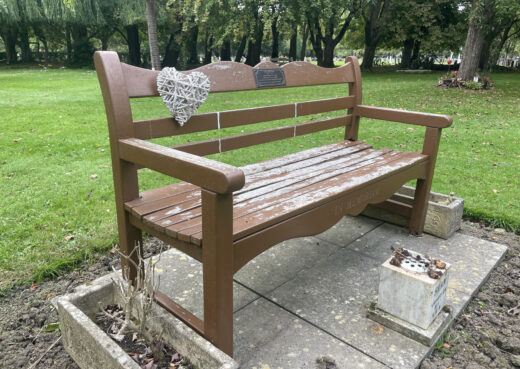 Side view of a 30 year old Beverley Bench with tan varnish