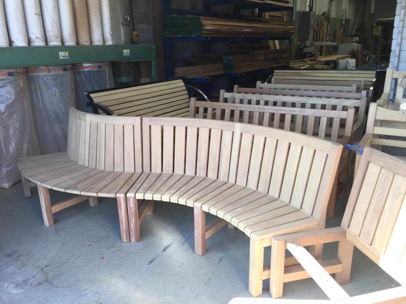 Curved bench in a beautiful garden