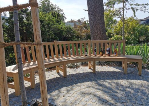 Curved bench positioned by the fire pit