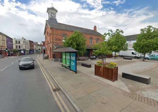 Streetscape view of Dromore with timber planters, seating and paved public space