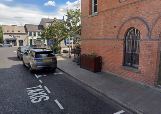 Public square in Dromore showing timber planters, trees and seating arrangement
