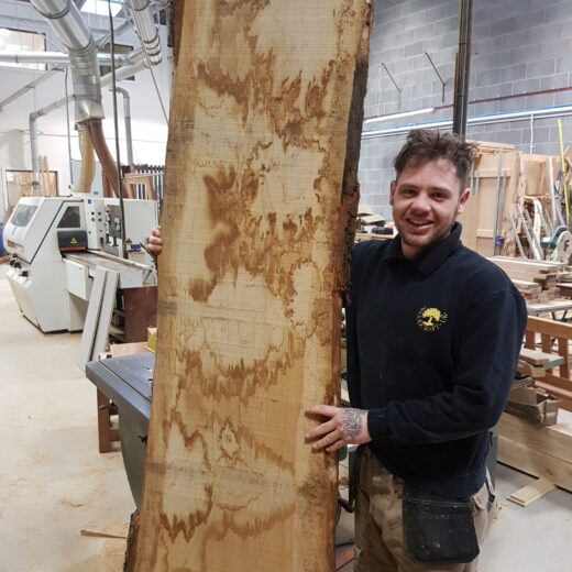 Luke with the raw hardwood section