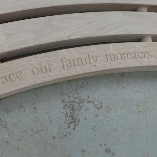 Bench engraved with the words: let's face our family monsters together