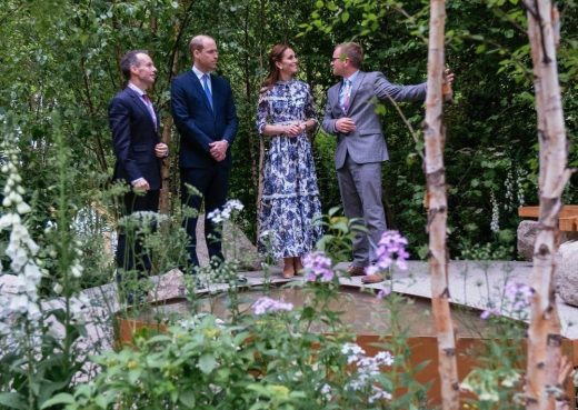 Alistair Bayford showing the Duke and Duchess Of Cambridge around the garden