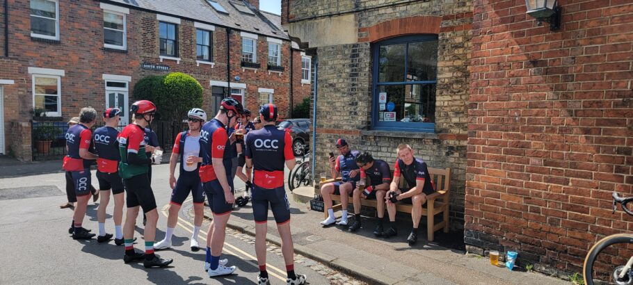 Members of Oxford Cycling Club gathered around the Johnny Morrison memorial bench after a ride outside The Punter pub.