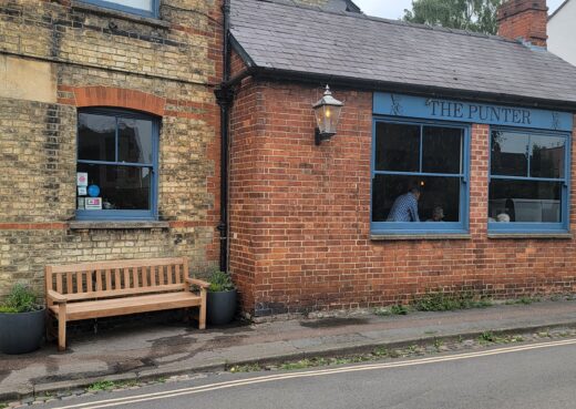 Johnny Morrison memorial York bench outside The Punter in Oxford with new contemporary planters on either side.