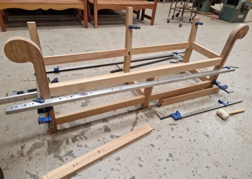 Gluing and clamping the frame of the Low Back Lutyens Bench in Construction.