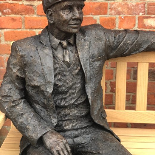 Detail of Arthur the bronze sculpture on our garden bench