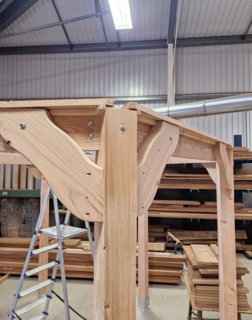 Shaped timber corner brace and joint detail on the bespoke pergola