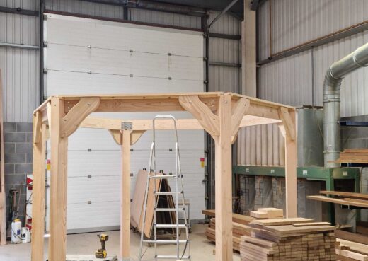 Large bespoke wooden pergola taking shape inside the Woodcraft workshop