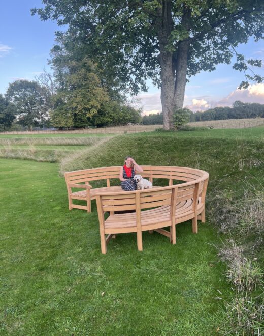 The new Rosedale Curved bench shown off in a garden