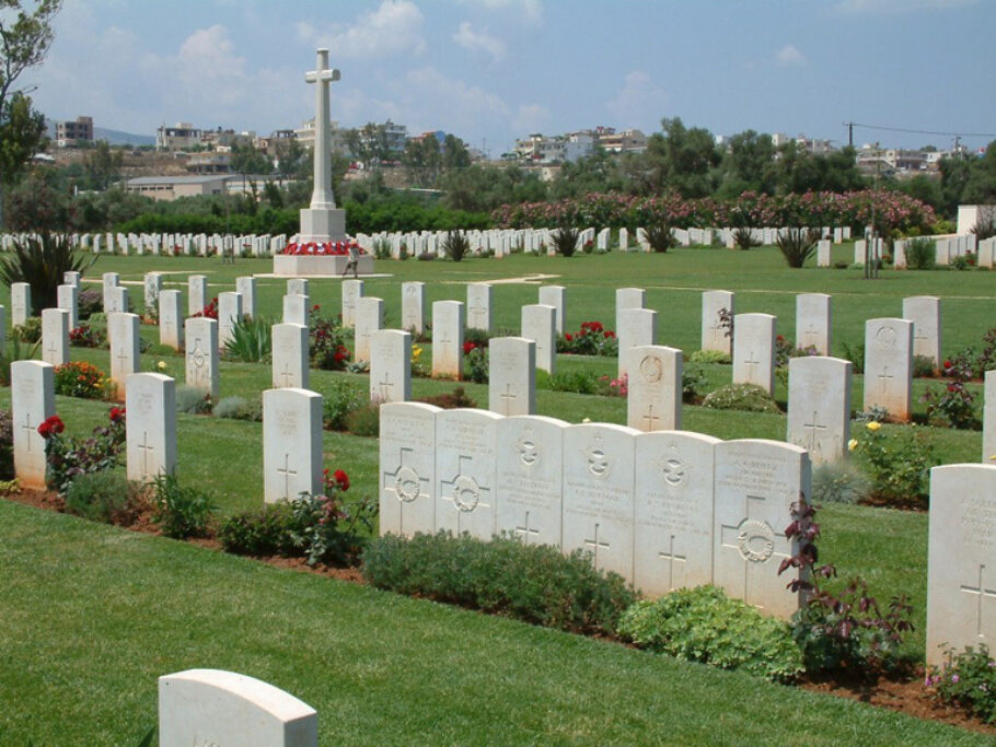 The Cross of Sacrifice at Suda Bay War Cemetery in Crete surrounded by Commonwealth war graves.