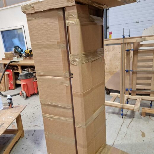 Packaged hardwood York bench prepared for international delivery to Commonwealth War Graves Commission site in Crete