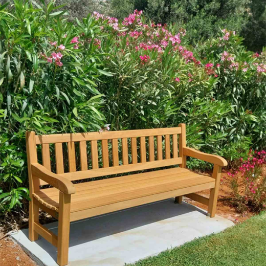 Woodcraft York bench positioned beside Mediterranean planting at Suda Bay War Cemetery, Crete.