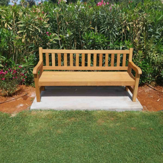 A handcrafted wooden York bench installed within the landscaped grounds of Suda Bay War Cemetery in Crete.