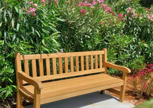 Woodcraft York bench positioned beside Mediterranean planting at Suda Bay War Cemetery, Crete.