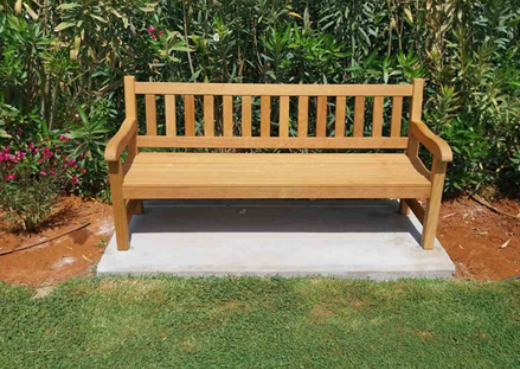 A handcrafted wooden York bench installed within the landscaped grounds of Suda Bay War Cemetery in Crete.