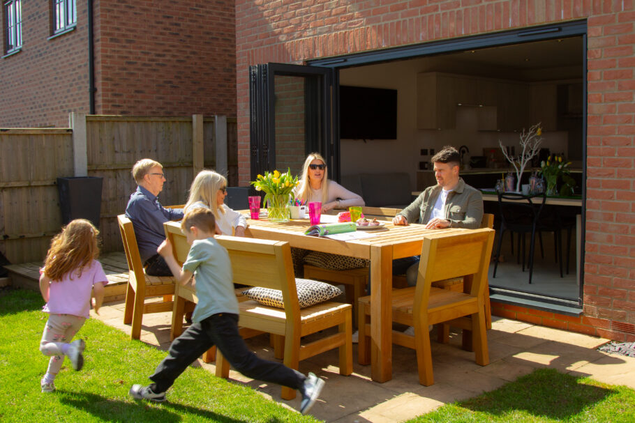 Family enjoying the new bespoke outdoor table