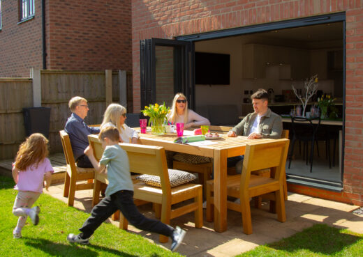 Family enjoying the new bespoke outdoor table