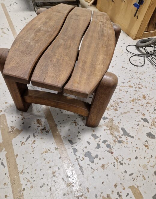 Solid hardwood outdoor coffee table with curved slats