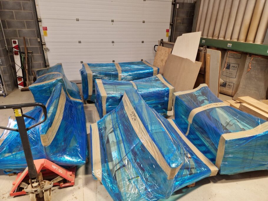 Handcrafted wooden benches wrapped and prepared for delivery in the Woodcraft UK workshop