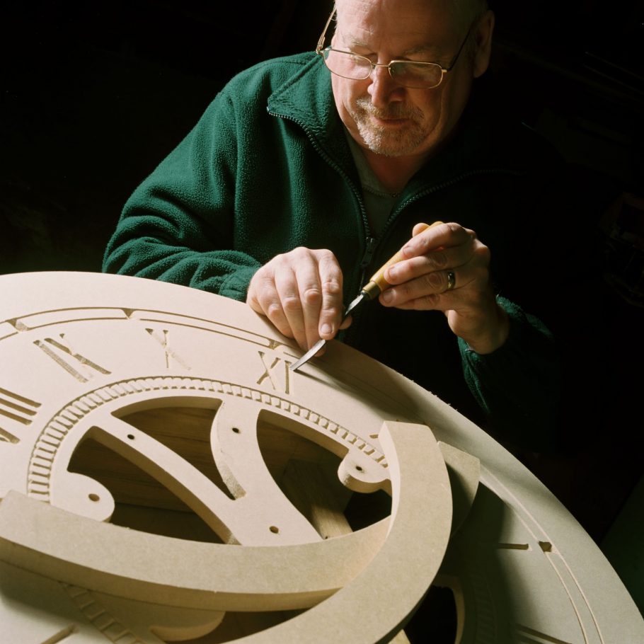 Engraved wooden clock face