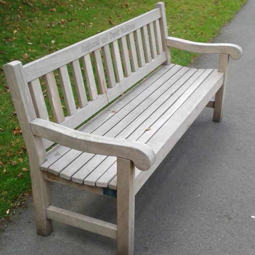 A weathered York bench in use by the Chelsea Pensioners