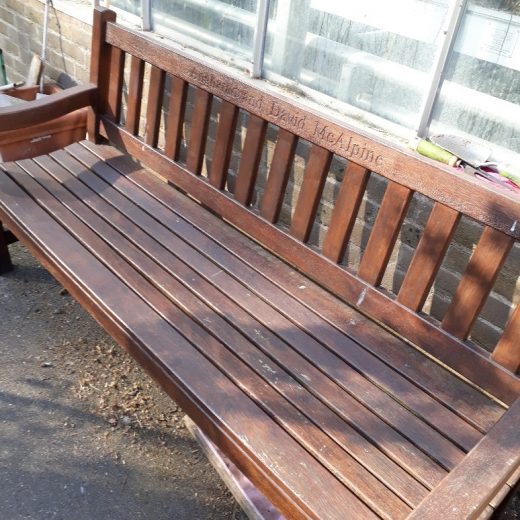 The York wooden bench with stain at the Royal Hospital Chelsea