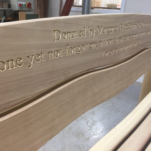 Waveform bench with engraved inscription