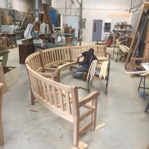 Craftsman Luke working on a bespoke curved bench 