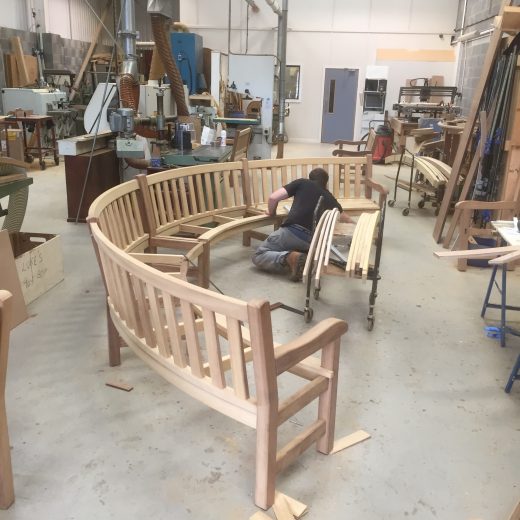 Craftsman Luke working on a bespoke curved bench