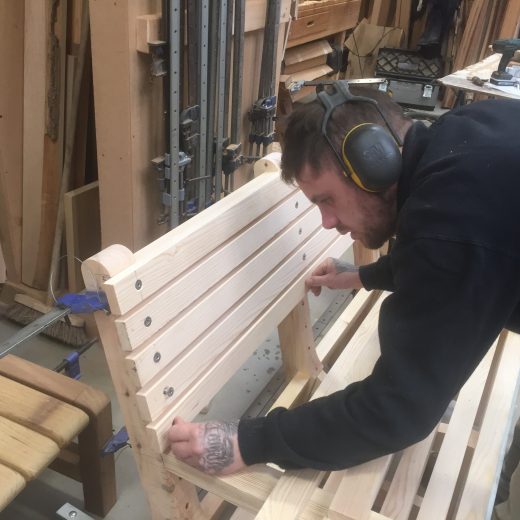 Luke assembling a bespoke wooden bench