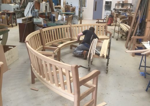 Craftsman Luke working on a bespoke curved bench