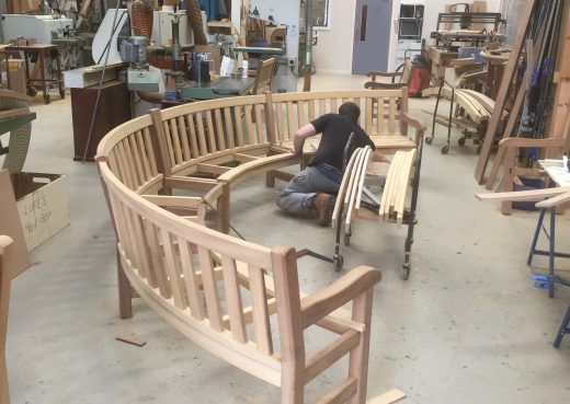 Craftsman Luke working on a bespoke curved bench 