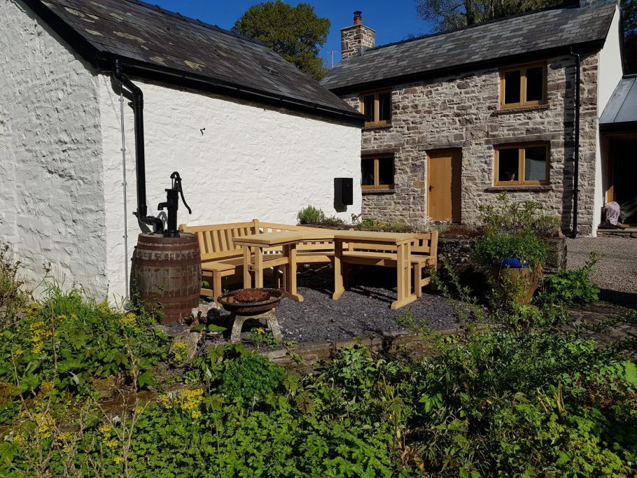 Pull out shot of the garden bench and table in situ