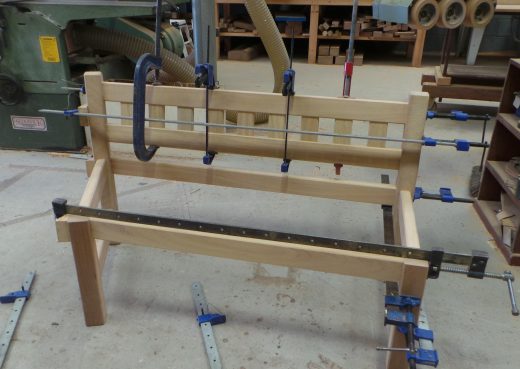 Glueing and clamping the right section of the garden bench