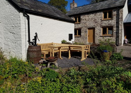 Pull out shot of the garden bench and table in situ