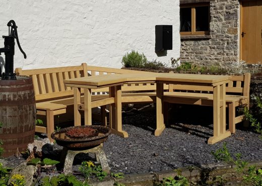 Bespoke corner angled wooden garden bench and table