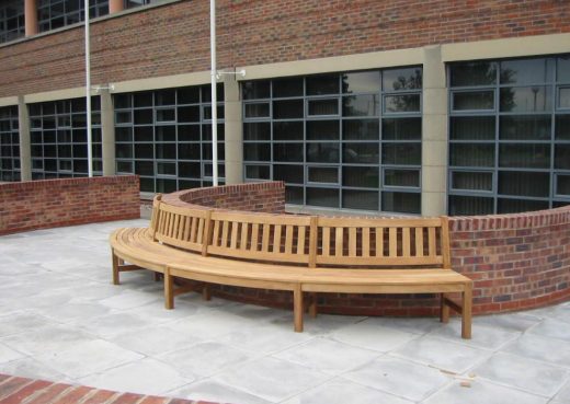 Curved street bench side view