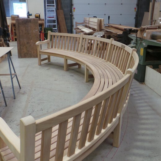 The large curved bench for Bushy Park