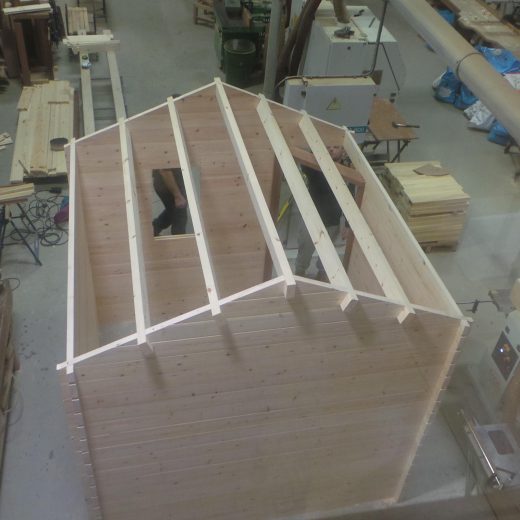 Wooden cabin with roof joists in place