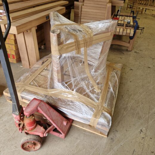 Tables in their packaging about to be loaded into the lorry