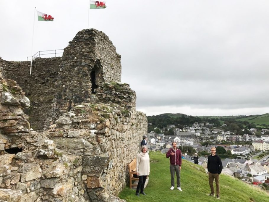 Family members it Criccieth castle with our wooden bench