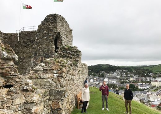 Family members it Criccieth castle with our wooden bench