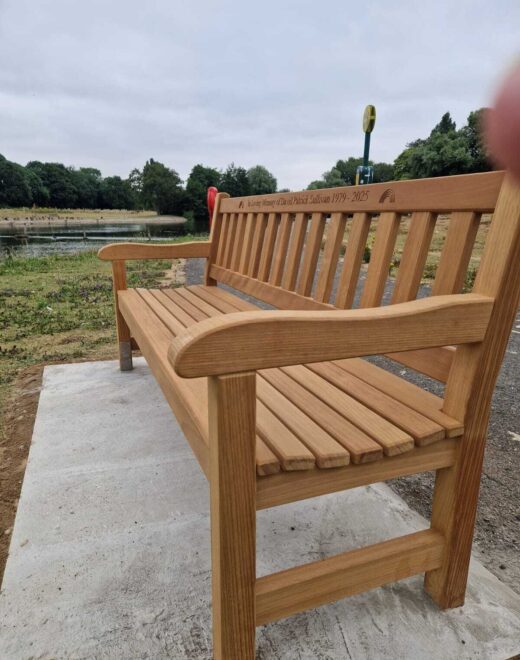 Handcrafted memorial bench installed beside East Park lake in Hull