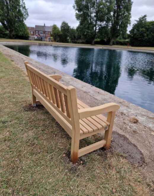 Rear view of a new Woodcraft York bench beside the boating lake in East Park